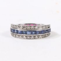 A SAPPHIRE, RUBY AND DIAMOND "DAY AND NIGHT" ETERNITY RING.