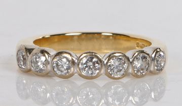 AN 18 CARAT GOLD AND DIAMOND RING.