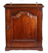 A GEORGE II OAK TABLE-TOP SPICE CUPBOARD, CIRCA 1750 AND LATER.