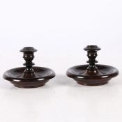 A PAIR OF EBONY 'TRAVELLING' CANDLE STICKS, CIRCA 1880.
