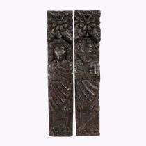 A PAIR OF ELIZABETH I CARVED OAK TERMS, CIRCA 1580.