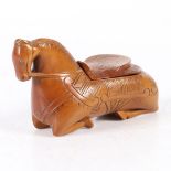 AN EARLY 18TH CENTURY CARVED SNUFF BOX IN THE FORM OF A HORSE.