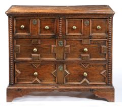 A CHARLES II OAK GEOMETRIC-MOULDED CHEST OF DRAWERS, CIRCA 1680 AND LATER.