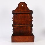 A GEORGE III OAK SPOON RACK, CIRCA 1800.