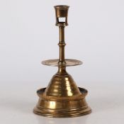 A RARE TUDOR BRASS 'CHALICE PATEN' CANDLESTICK, ENGLISH, CIRCA 1550.