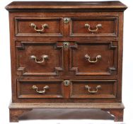 A CHARLES II OAK GEOMETRIC-MOULDED CHEST OF DRAWERS, CIRCA 1680.