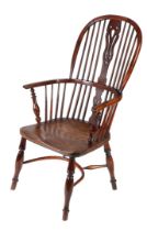 A VICTORIAN YEW WINDSOR ARMCHAIR, NORTH-EAST MIDLANDS, CIRCA 1850.