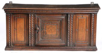 AN ELIZABETH I OAK MURAL LIVERY CUPBOARD, CIRCA 1590.