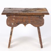 A 16TH CENTURY AND LATER ENGLISH OAK BOARDED STOOL.