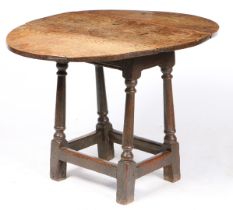 A RARE CHARLES II OAK STOOL-TABLE, CIRCA 1680.