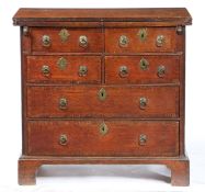 A SMALL GEORGE II OAK BACHELORS' CHEST, CIRCA 1740.