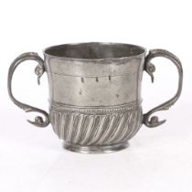 A RARE AND FINE QUEEN ANNE PEWTER TWIN-HANDLED GADROONED CUP, WIGAN, CIRCA 1705.