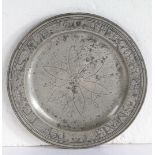 A GOOD AND DOCUMENTED QUEEN ANNE PEWTER MULTIPLE-REEDED WRIGGLEWORK PLATE, CIRCA 1700.