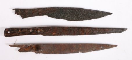 THREE 15TH-16TH CENTURY EXCAVATED IRON KNIVES.