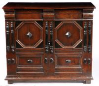 A SMALL CHARLES II OAK ENCLOSED CHEST OF DRAWERS, CIRCA 1670.