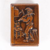 A 19TH CENTURY TOBACCO BOX, THE CARVED FRONT DEPICTING, A COBBLER, PLAYING THE FIDDLE.