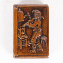 A 19TH CENTURY TOBACCO BOX, THE CARVED FRONT DEPICTING, A COBBLER, PLAYING THE FIDDLE.
