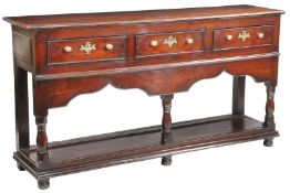 A GEORGE II OAK OPEN DRESSER BASE, MONTGOMERYSHIRE, CIRCA 1740.