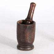 AN early 19th CENTURY TREEN PESTLE AND MORTAR.