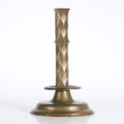 A RARE 16TH CENTURY BRASS ENGRAVED PILLAR CANDLESTICK, FRENCH.