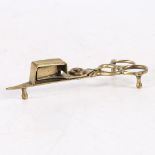 A SMALL GEORGE III CAST BRASS CANDLE-SNUFFER, CIRCA 1790.