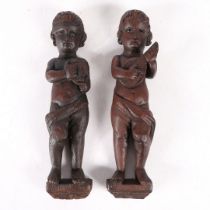 A PAIR OF CARVED OAK FIGURES.