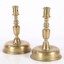 A NEAR PAIR OF 17TH CENTURY BRASS CANDLESTICKS, FLEMISH.