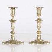 A PAIR OF PAKTONG GEORGE III STYLE TAPER CANDLESTICKS.