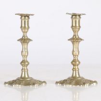 A PAIR OF PAKTONG GEORGE III STYLE TAPER CANDLESTICKS.