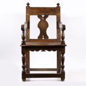 AN UNUSUAL MID-17TH CENTURY OAK OPEN ARMCHAIR, ENGLISH, POSSIBLY DEVON.