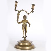 A BRASS FIGURAL CANDLESTICK, IN THE 16TH CENTURY GERMAN 'LANDESKNECHT' MANNER.