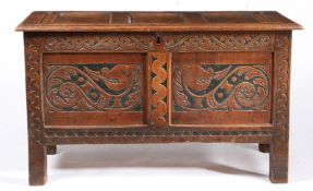 A BOLD DESIGNED CHARLES II OAK AND STAINED COFFER, WEST COUNTRY, CIRCA 1660.