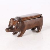 A 19TH CENTURY FRUITWOOD SNUFF BOX, IN THE FORM OF A PIG.
