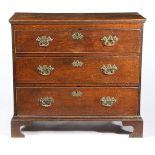 A GEORGE III OAK CHEST OF DRAWERS, CIRCA 1760.