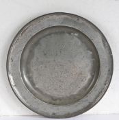 A CHARLES II PEWTER SINGLE REED AND WRIGGLEWORK DECORATED DISH, YORKSHIRE, DATED 1674.