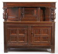 A CHARLES II OAK JOINED COURT CUPBOARD, YORKSHIRE, CIRCA 1660.