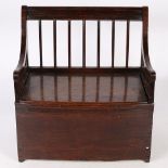 A REGENCY OAK MINIATURE/DOLL'S BOX-SETTLE, CIRCA 1820.