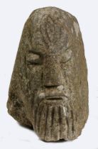 AN ANTIQUE CARVED HEAD IN THE CELTIC MANNER.