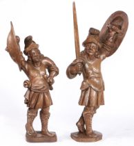 A PAIR OF 17TH CENTURY CARVED OAK SOLDIERS, BEARING ARMS, RESIDUAL PAINT, FLEMISH.