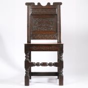 AN UNUSUAL CHARLES II OAK BACKSTOOL, NORTH COUNTRY, POSSIBLY DERBYSHIRE, CIRCA 1670.