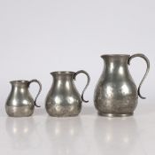 A SET OF THREE GEORGE III PEWTER PRE-IMPERIAL JUGS, CIRCA 1780.