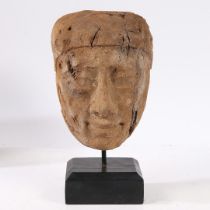 AN ANCIENT EGYPTIAN CEDAR WOOD MUMMY MASK.