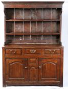 A RELATIVELY SMALL GEORGE II OAK HIGH DRESSER, NORTH WALES, CIRCA 1730.