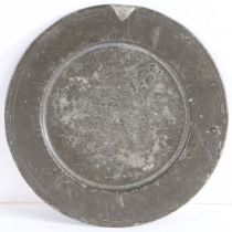 A RARE CHARLES II PEWTER PATEN, CIRCA 1680.