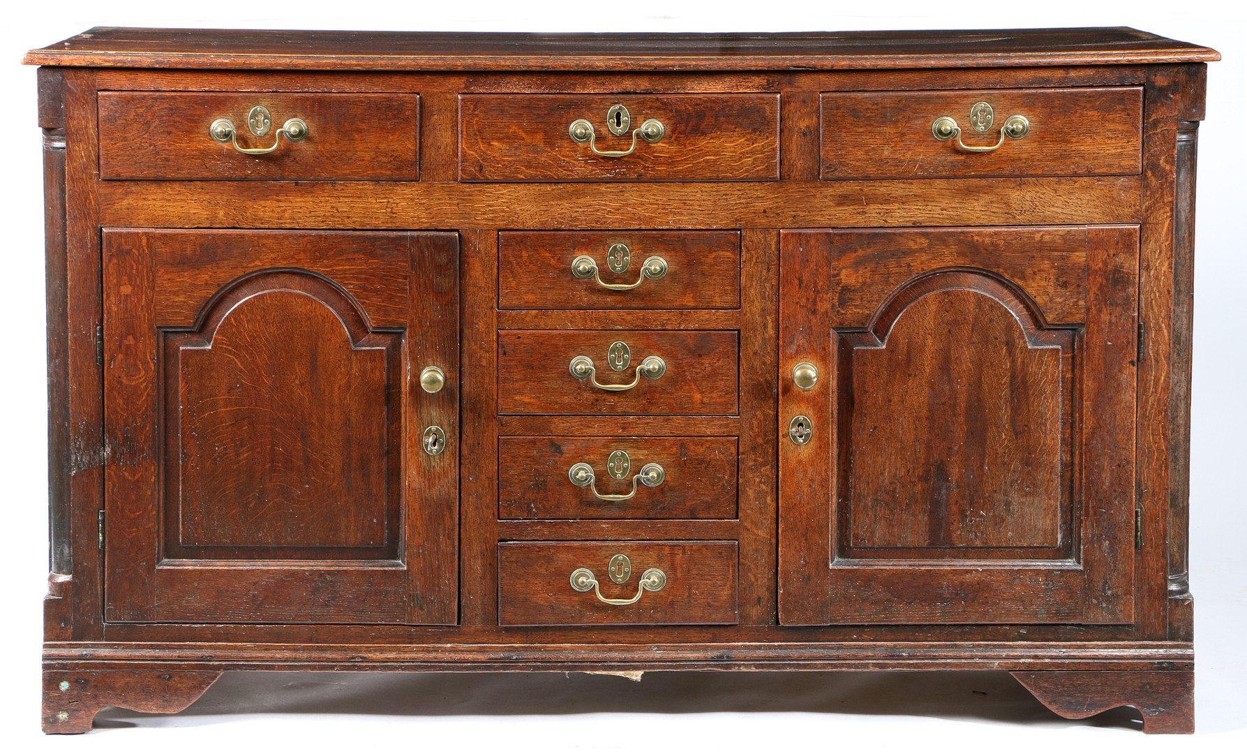 A GEORGE II OAK FULLY ENCLOSED DRESSER BASE, NORTH WALES, CIRCA 1750.