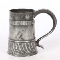 A RARE WILLIAM & MARY PEWTER GADROONED PINT MUG, CIRCA 1700-02.