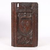 AN EARLY 16TH CENTURY CARVED OAK ROYAL ARMORIAL PANEL, CIRCA 1500-20.