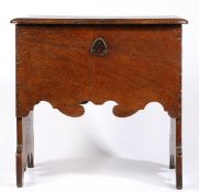 A HIGHLY UNUSUAL WILLIAM & MARY OAK BOARDED BOX-STOOL, CIRCA 1690.