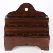 A GEORGE III OAK CAWL SPOON RACK, WELSH, CIRCA 1800.