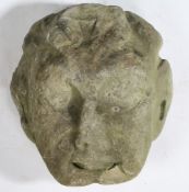 AN 18TH CENTURY CARVED STONE HEAD POSSIBLY DEPICTING PAN.